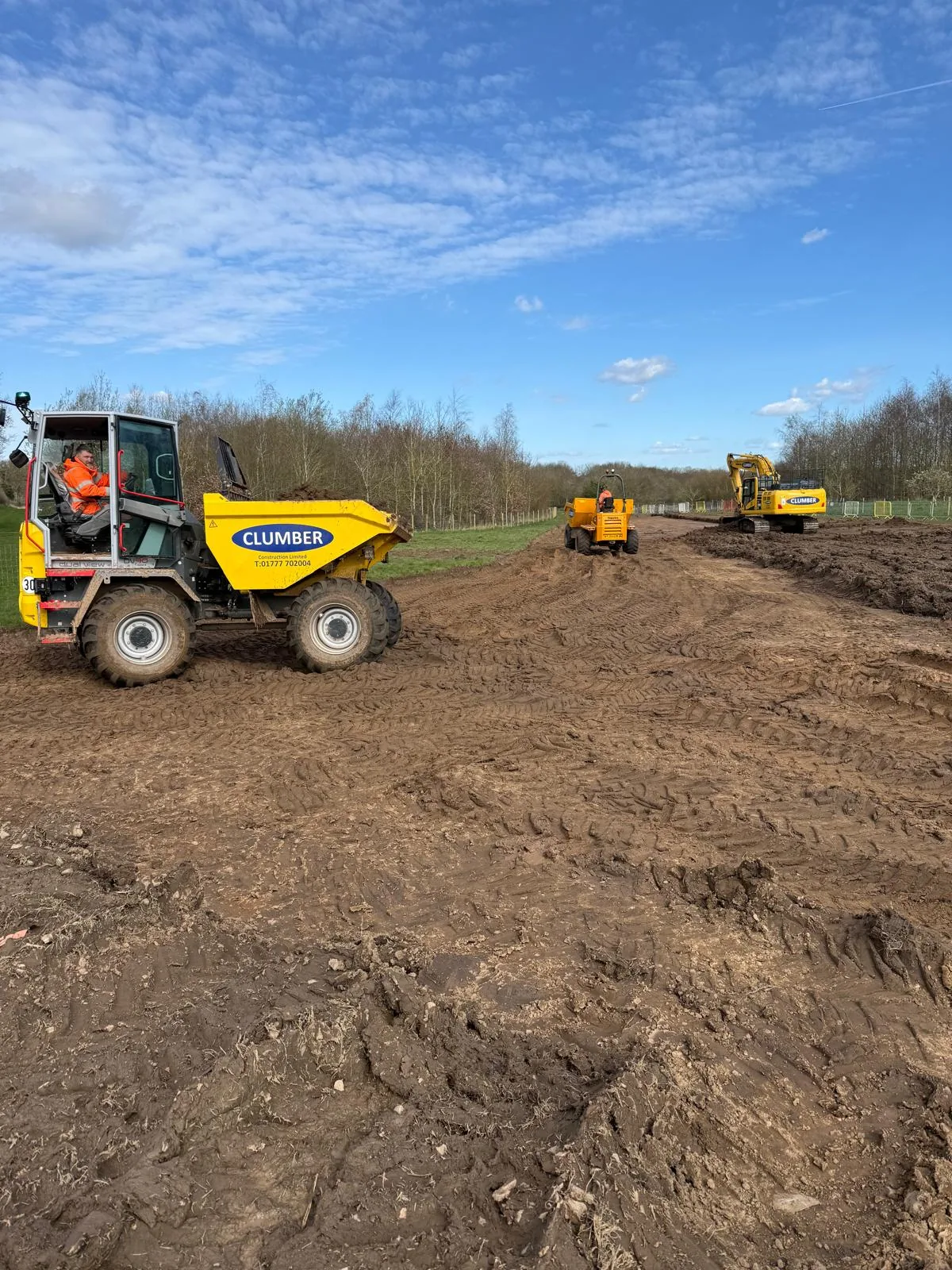 Clumber dumper trucks and excavator carrying out earthworks on Packington rising main route